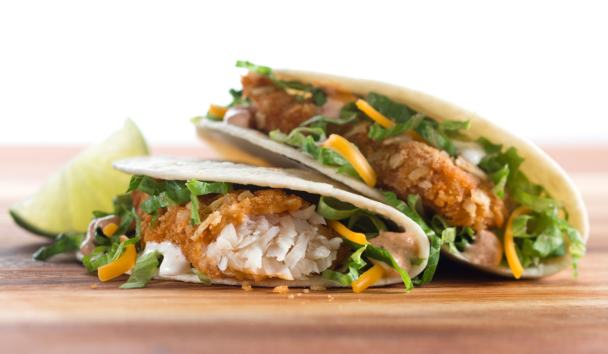Crispy Fish Tacos Made With Crispy Fish, Fajita Sour Cream, Ranch Dressing, Lettuce, Cheddar Cheese And Lime
