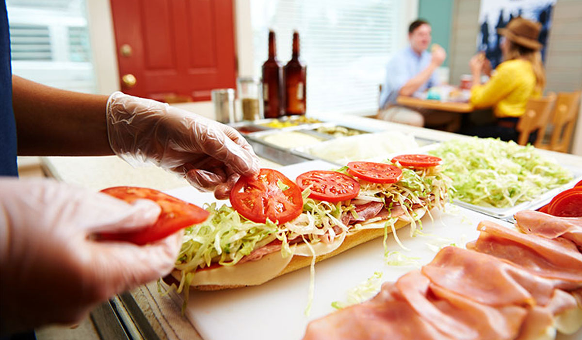 A Jersey Mike's Sub Is Being Prepared In The Restaurant