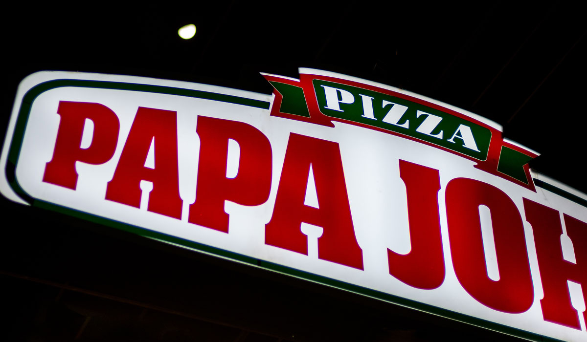 Papa John's Logo With A Half Moon In The Background