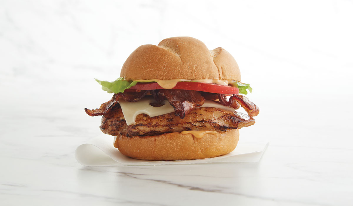 pollo_1 Pollo Tropical's Grilled Chicken BLT Sandwich Features The Brand's Famous Fire Grilled Chicken, Double Smoked Premium Bacon, Swiss Cheese, Lettuce And Fresh Sliced Tomato Served With Chipotle Mayo Sauce