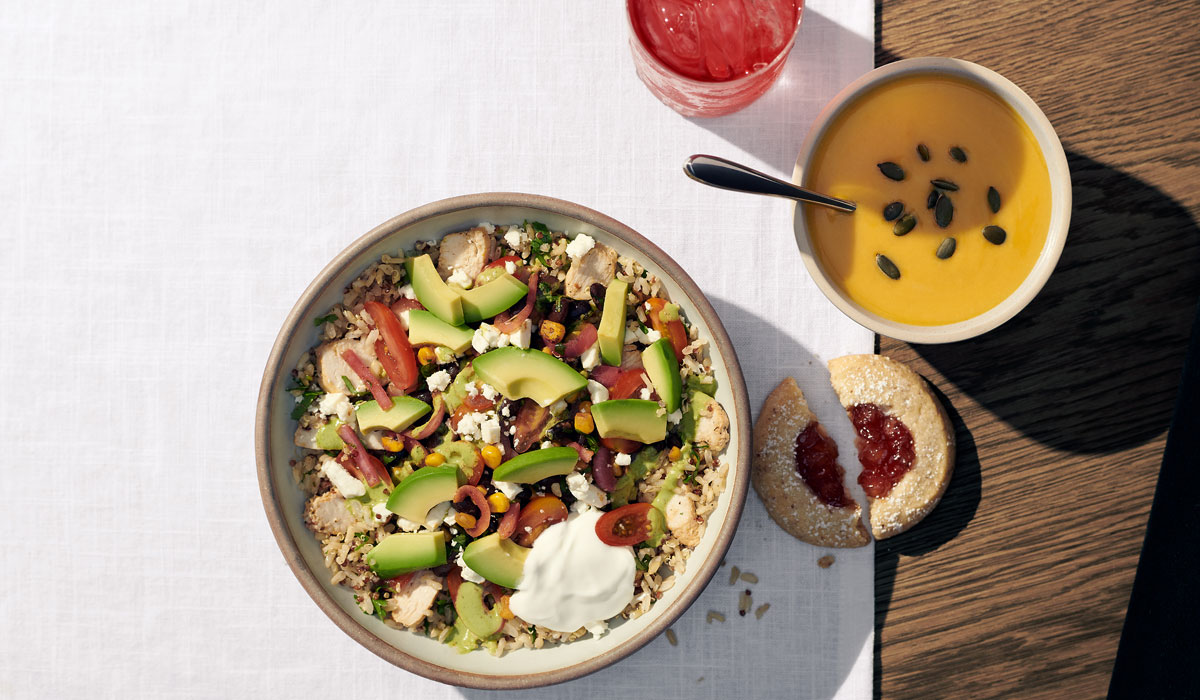 Panera Bread's Baja Grain Bowl On A Table Next To Soup