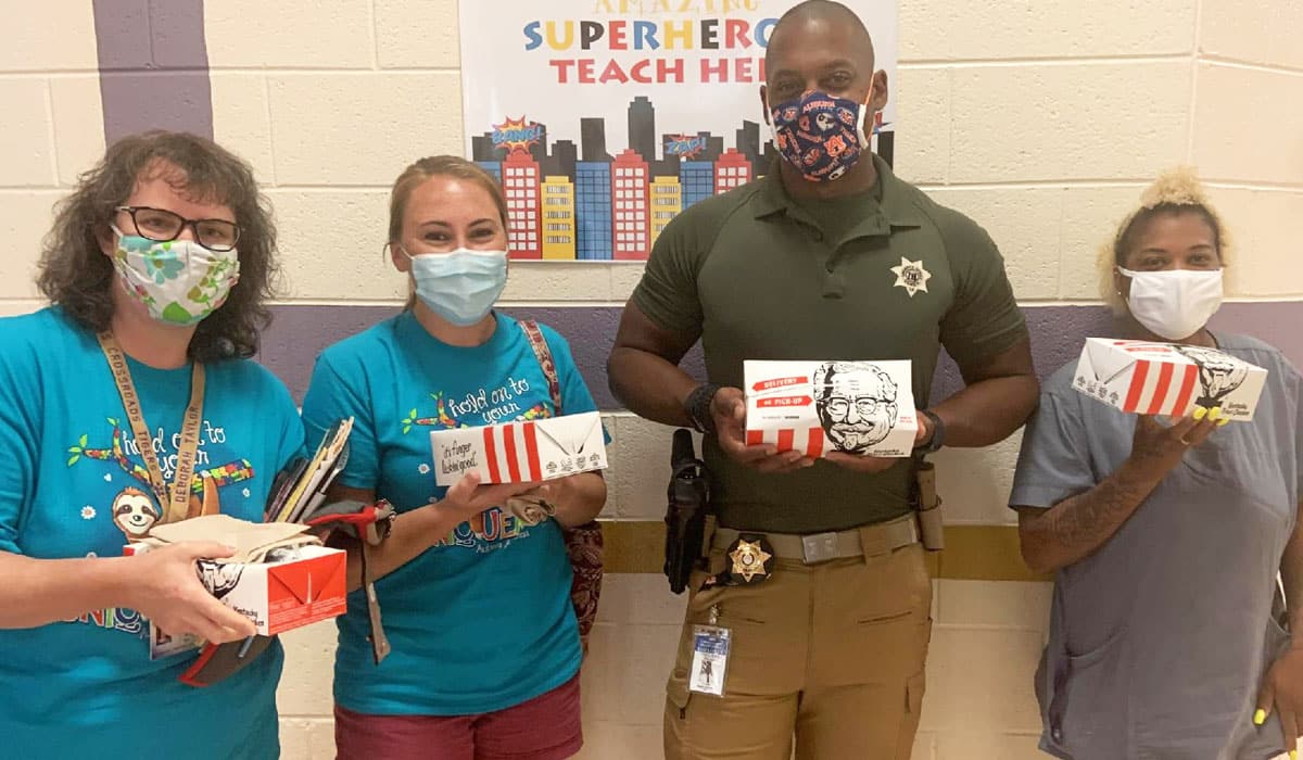 Taechers Hold Boxes Of KFC Chicken