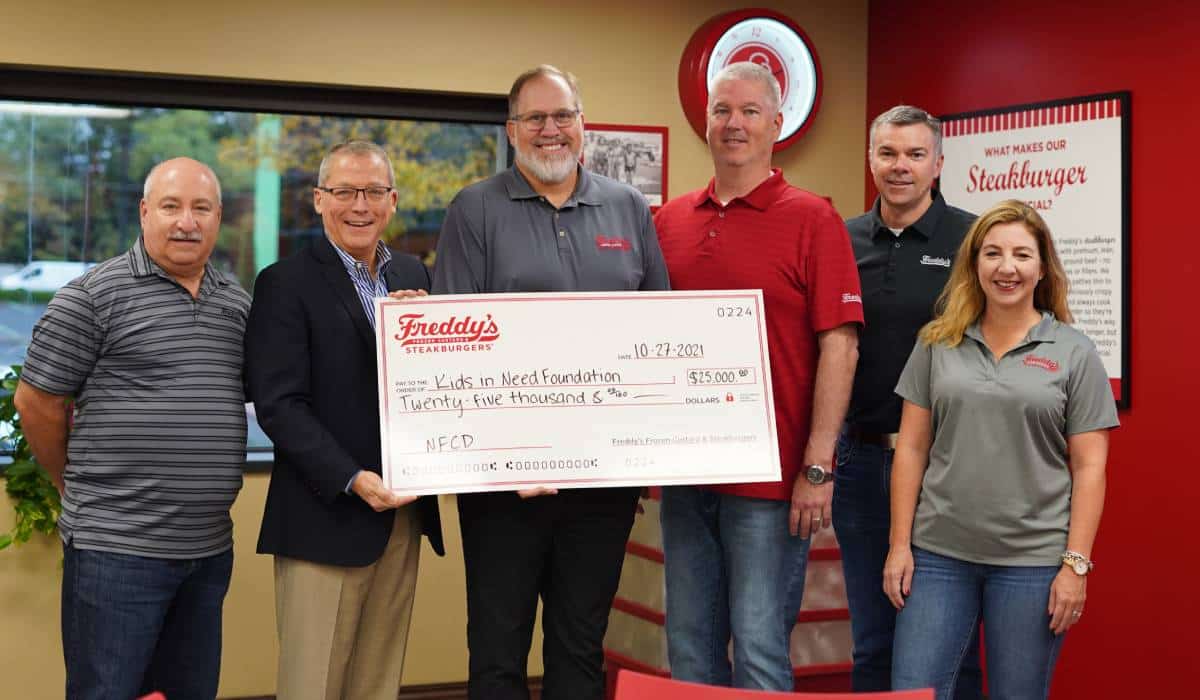 Freddy's Presents Check To Kids In Need Foundation