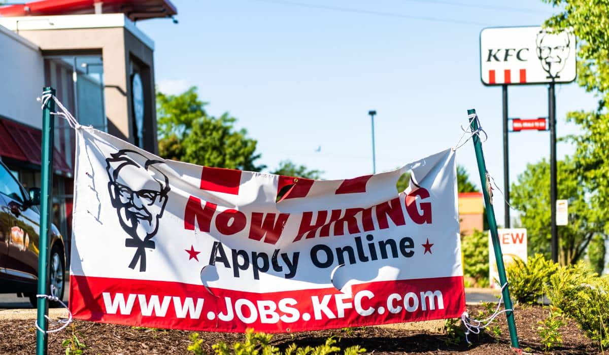 Irginia College City With Sign On Street Road For KFC Kentucky Fried Chicken Now Hiring Due To Lack Of Workers In Pandemic