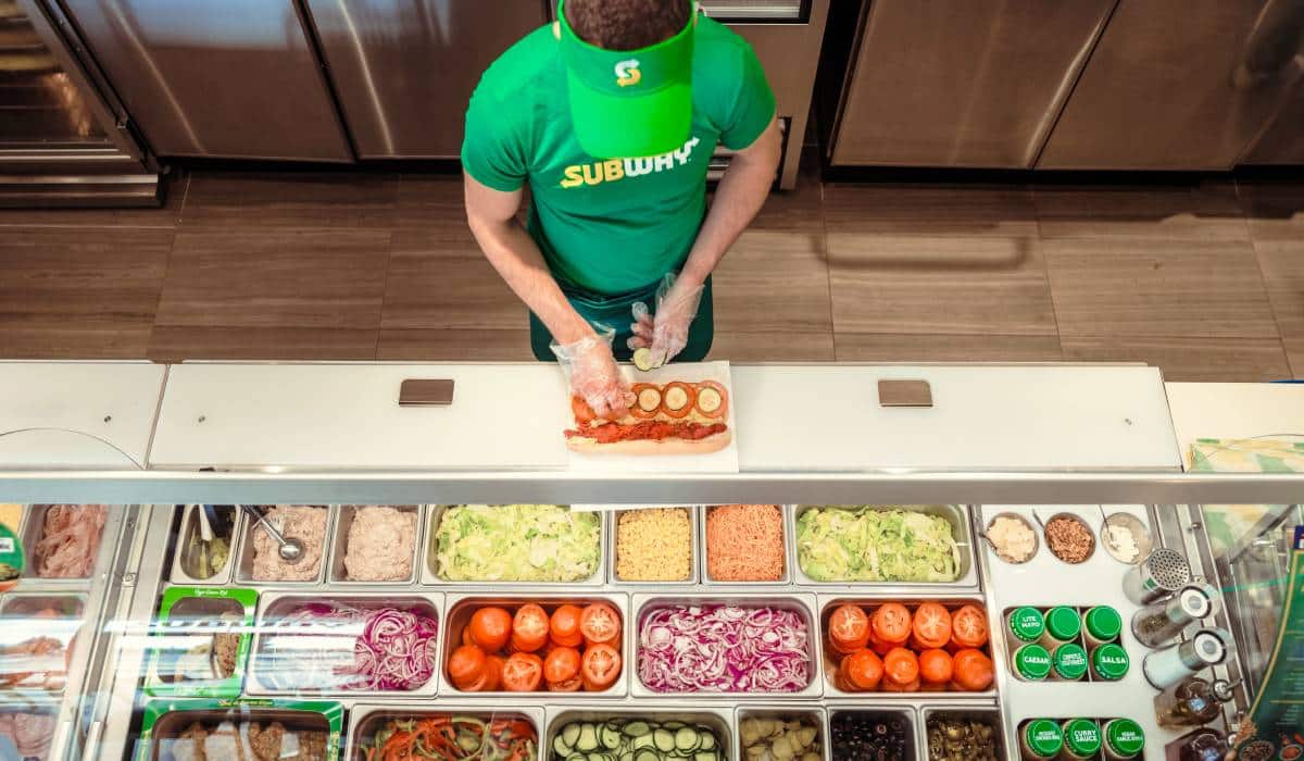 Subway Employee Preparing Food