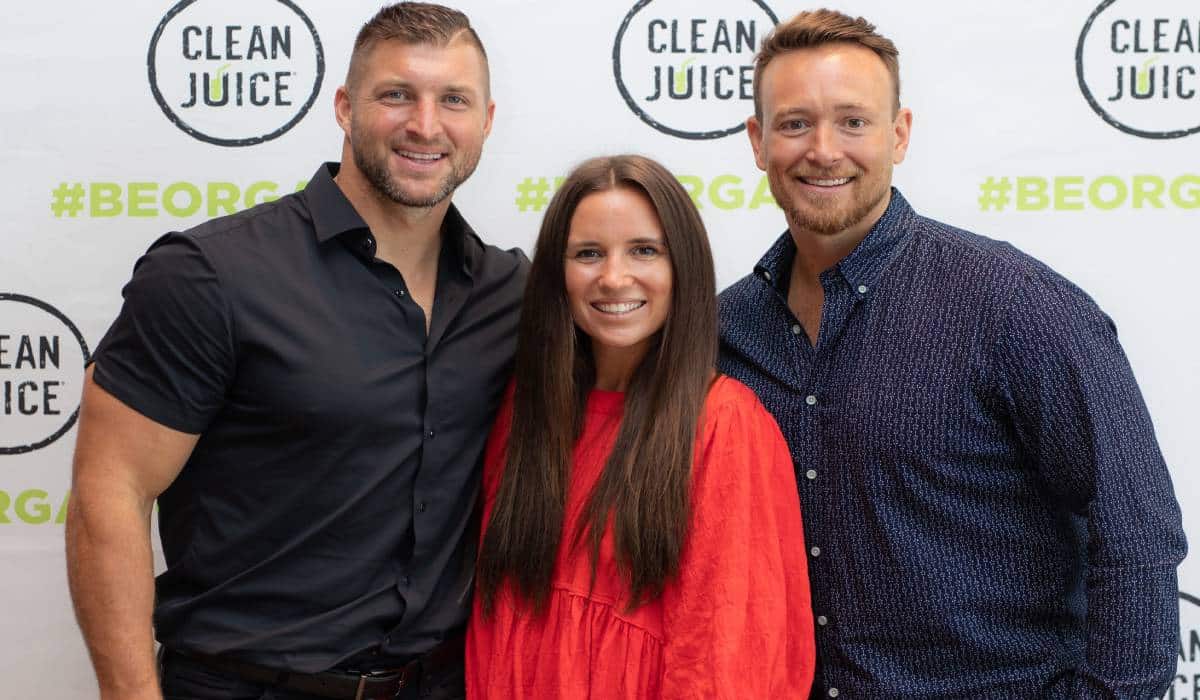 A Picture Of Tim Tebow And Clean Juice Founders Landon And Kat Eckles
