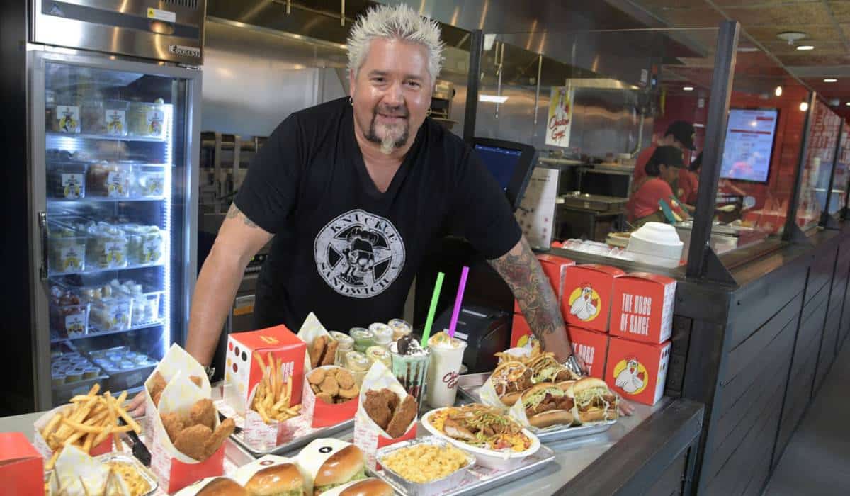 Guy Fieri Standing By A Plethora Of Chicken Guy! Food