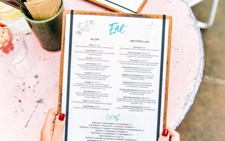 Menu being held by restaurant customer.