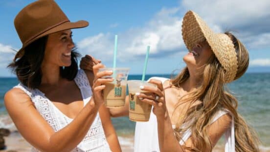 Customers enjoying beverages from Bad Ass Coffee of Hawaii.