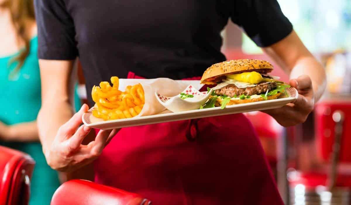 Waitress serving in American diner or restaurant.