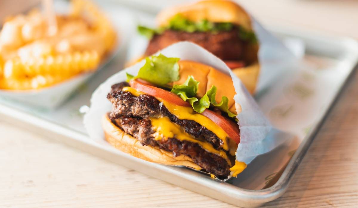 Shake Shack burger and fries on plate.