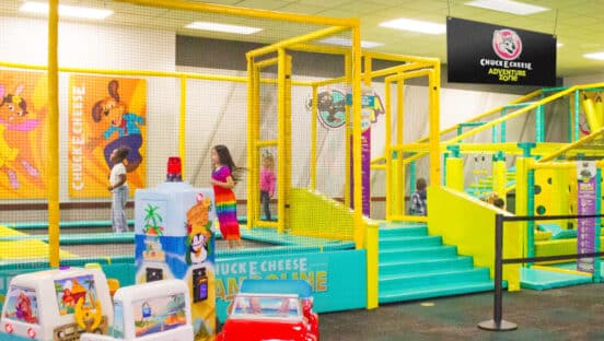 Children enjoying the Chuck E. Cheese adventure zone.