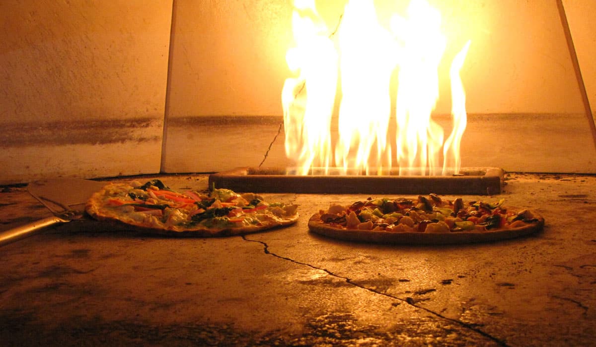 Fired Pie pizzas in an oven.