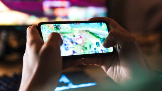 Player playing a mobile game.