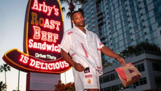 Model wearing Arby's 13 Hour Drip Fit.