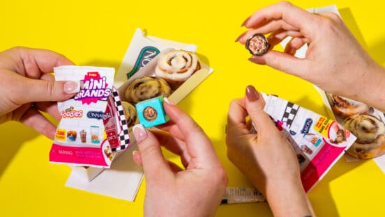 Customers eating Cinnabon and picking out ZURU Mini Brands.