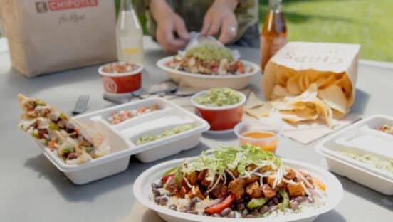 Chipotle bowls of food on a table.
