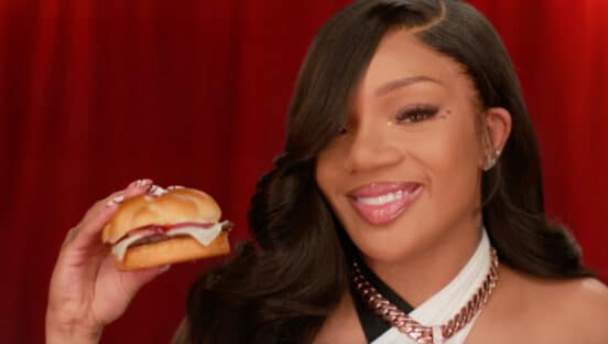 GloRilla holding a burger.