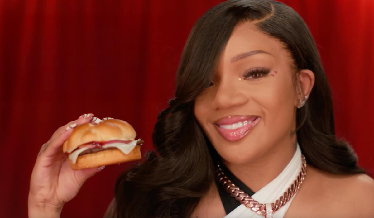 GloRilla holding a burger.