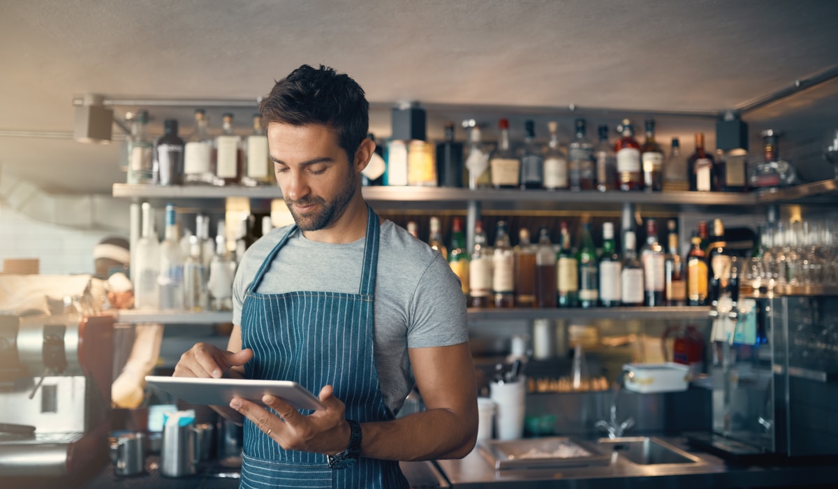 Restaurant employee with a tablet.