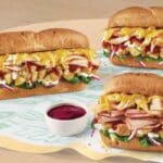 All three subs come piled high with Monterey Cheddar cheese, spinach, red onions, mayo and Subway’s new stuffing and cranberry sauce.