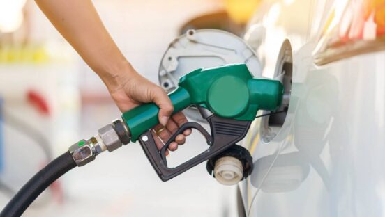 Gas being put into a car.