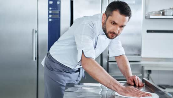 Restaurant worker cleaning.