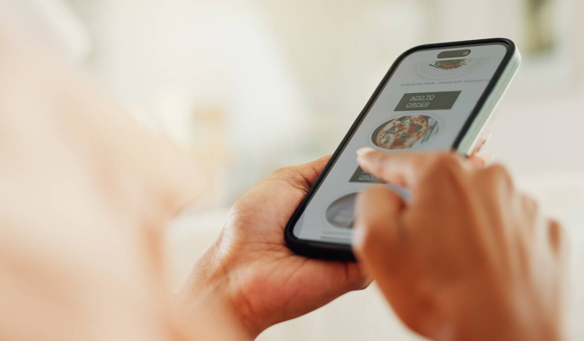 Restaurant app in the hand of a customer.