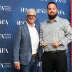 Aaron Wiswell receives award.